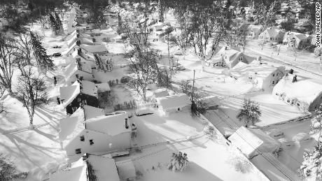 In this drone image, snow blankets a neighborhood, Sunday, December 25, 2022, in Cheektowaga, Erie County, New York.