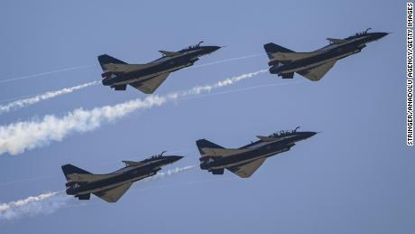 Chinese J-10 fighter jets shown in formation during a 2022 Airshow in Zhuhai, China. 