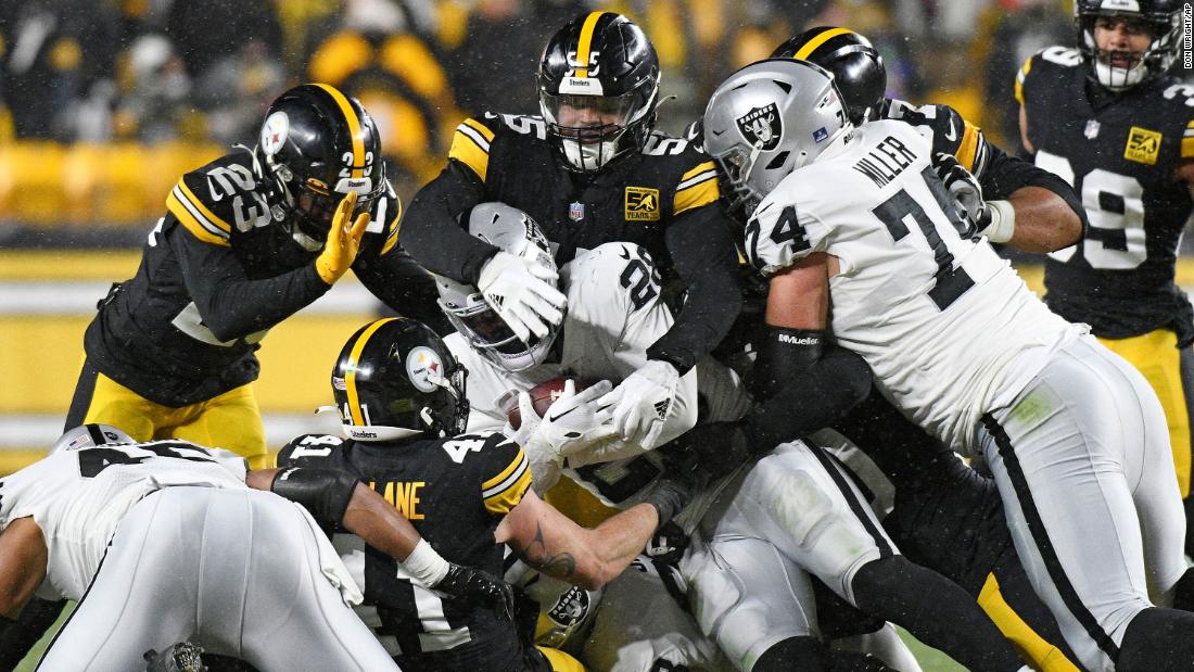 Las Vegas Raiders running back Josh Jacobs (28) is tackled during the second half of the game against the Pittsburgh Steelers. The Steelers won 13-10.