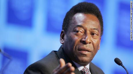 DAVOS, Switzerland:  Former Brazilian soccer star Pele, Director of Empresas Pele (L) talks during the World Economic Forum session &quot;Can a ball change the world: the role of sports in Development&quot; 26 January 2006 in Davos.  AFP PHOTO FABRICE COFFRINI  (Photo credit should read FABRICE COFFRINI/AFP via Getty Images)