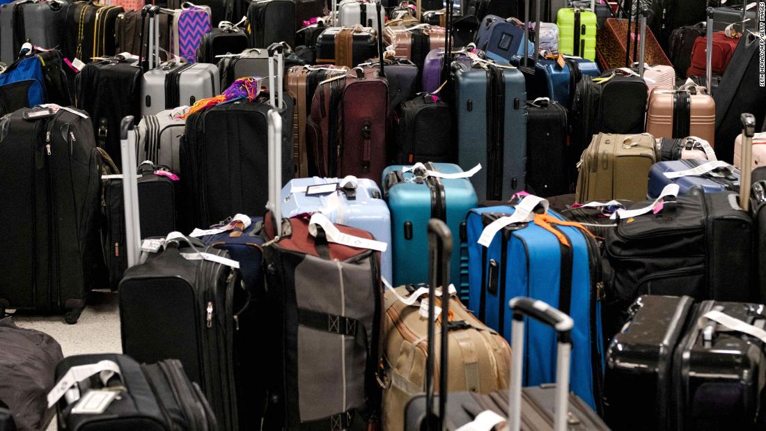 Hundreds of unclaimed suitcases sit near the Southwest Airlines baggage claim area in Tennessee&#39;s Nashville International Airport after the airline canceled thousands of flights on December 27.