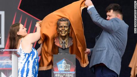 Art McNally&#39;s grandchildren unveil his bronze bust during the 2022 Pro Hall of Fame enshrinement ceremony in Canton, Ohio.