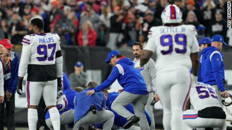 Hamlin is examined after collapsing on the field in the first quarter of Monday night&#39;s game between the Buffalo Bills and Cincinnati Bengals. 
