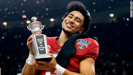 Young holds the Most Outstanding Player trophy as he celebrates after Alabama&#39;s victory over Kansas State at the Sugar Bowl.