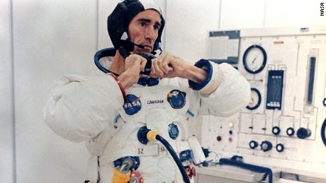 Walt Cunningham adjusts his pressure suit before the Apollo 7 launch on October 11,1968.