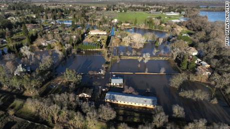 An aerial view of flooded areas around homes on Sunday after heavy rain caused a levee to break, flooding Sacramento County roads and properties near Wilton, California.