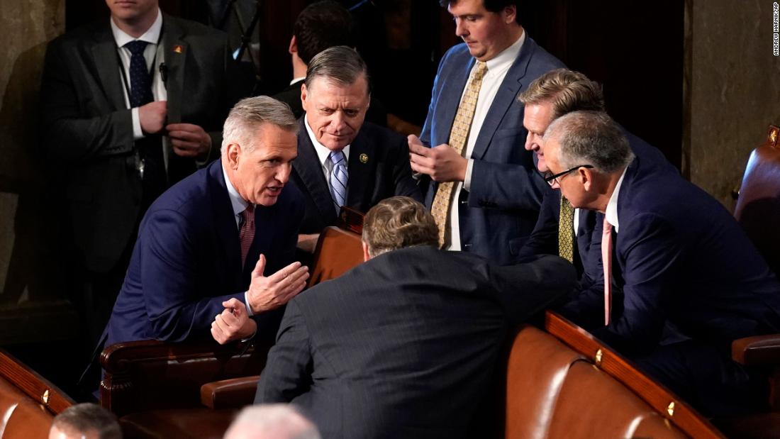 McCarthy talks to other lawmakers after the first vote.
