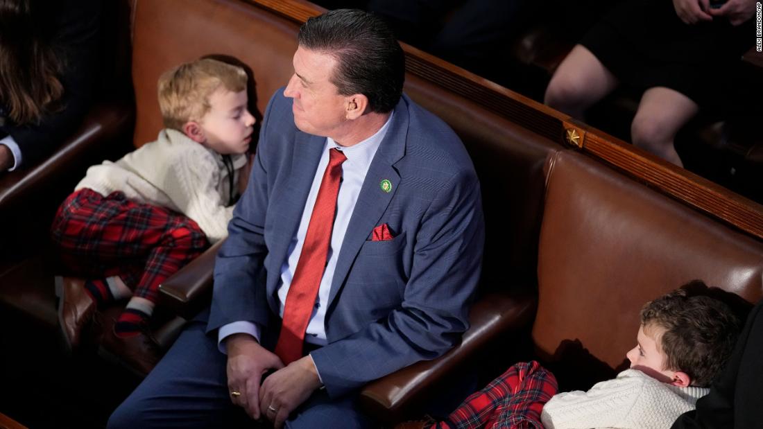 US Rep. Kevin Mullin, a Democrat from California, sits with his children during one of Tuesday&#39;s votes.