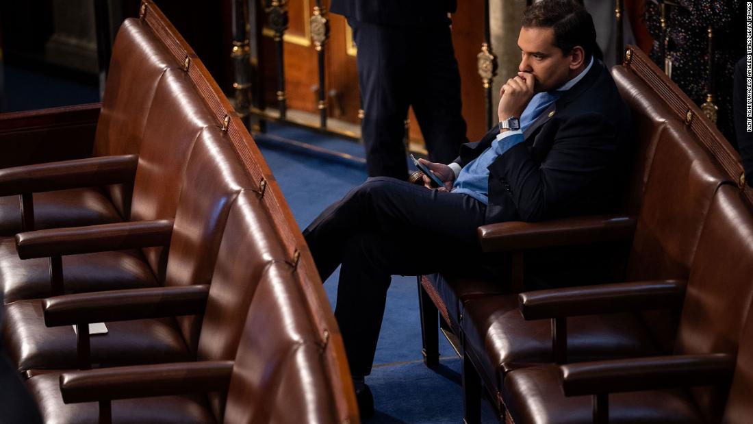 US Rep.-elect George Santos sits alone in the House chamber Tuesday. &lt;a href=&quot;https://www.cnn.com/politics/live-news/new-congress-sworn-in-2023/h_e5ecb07a90c8124c8a1f89de5f3f1430&quot; target=&quot;_blank&quot;&gt;The embattled New York Republican&lt;/a&gt; faces a federal probe into his finances and mounting scrutiny and condemnation over lies about his biography. 