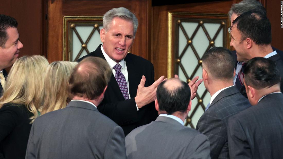 McCarthy talks to colleagues inside the House chamber on Wednesday.