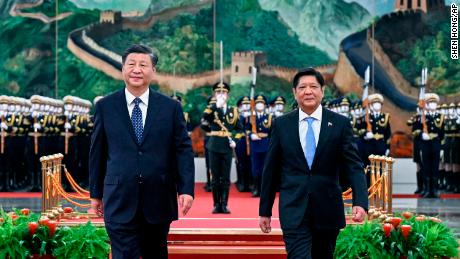 Visiting Philippine President Ferdinand Marcos Jr. walks alongside Chinese leader Xi Jinping at the Great Hall of the People in Beijing on January 4, 2023.
