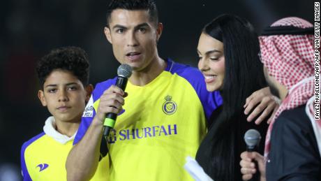  Portuguese forward Cristiano Ronaldo, his partner Georgina Rodriguez and his son Cristiano Ronaldo Jr, greets the crowd at the Mrsool Park Stadium.