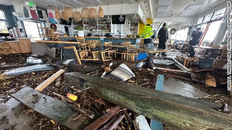 A support piece from the Capitola Wharf is seen inside the storm-damaged Zelda&#39;s restaurant in Capitola on January 5, 2023.