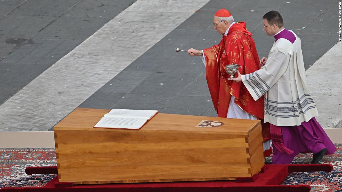 Cardinal Giovanni Battista Re blesses the coffin of Pope Emeritus Benedict XVI during his funeral mass at St. Peter&#39;s Square in the Vatican.