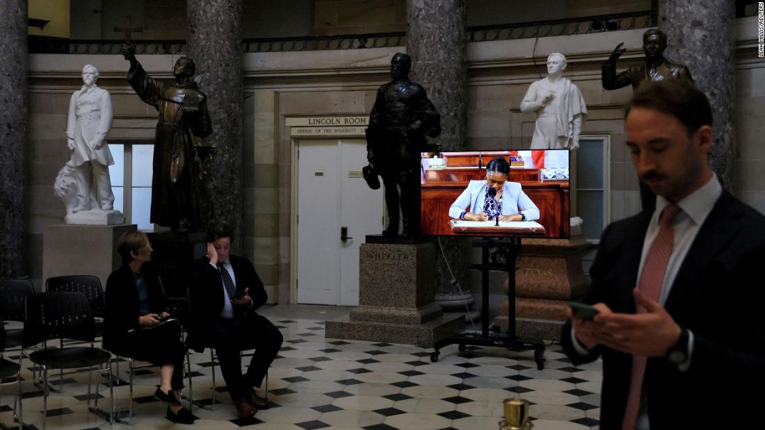 A live video feed of the House chamber is shown in the Capitol&#39;s Statuary Hall on Thursday.