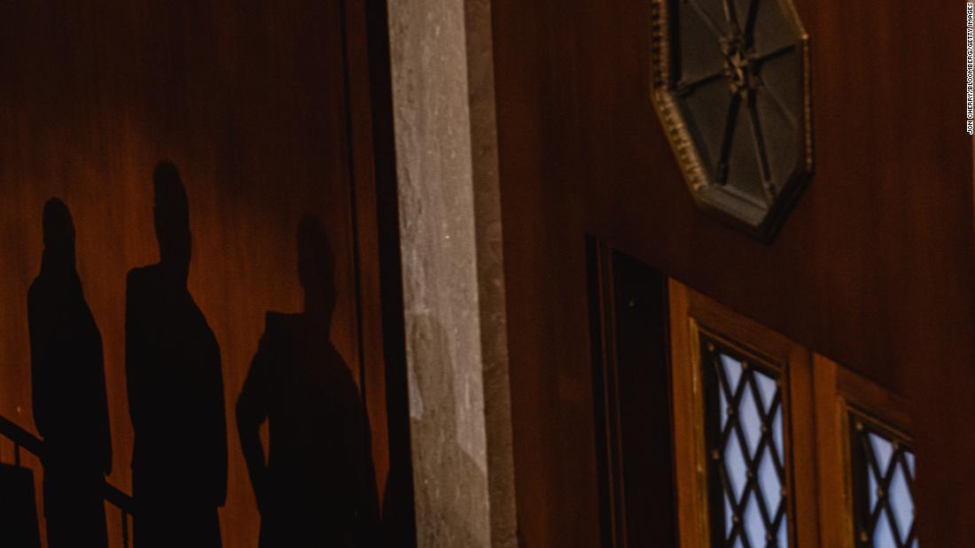 Shadows of lawmakers are cast on the House chamber wall on Thursday.