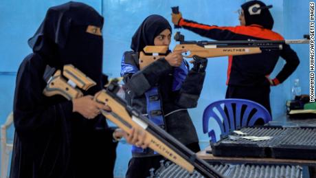 Women athletes aim their air rifles while competing in a local shooting championship in Yemen&#39;s Houthi rebel-held capital Sanaa on January 3.