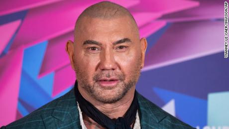 Dave Bautista poses for photographers upon arrival at the photo call for the film &quot;Glass Onion: A Knives Out Mystery&quot; in October.