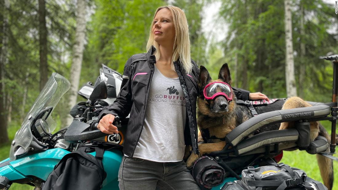 This woman is riding around the world with her German shepherd