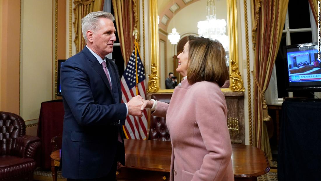 McCarthy shakes hands with his predecessor, Nancy Pelosi, after being elected Speaker of the House on Saturday.