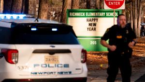 Police respond to a shooting at Richneck Elementary School, Friday, Jan. 6, 2023 in Newport News, Va. A shooting at a Virginia elementary school sent a teacher to the hospital and ended with &quot;an individual&quot; in custody Friday, police and school officials in the city of Newport News said. (Billy Schuerman/The Virginian-Pilot via AP)