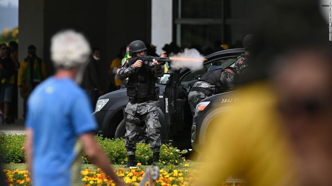 Police confront protesters invading the National Congress in Brasilia.