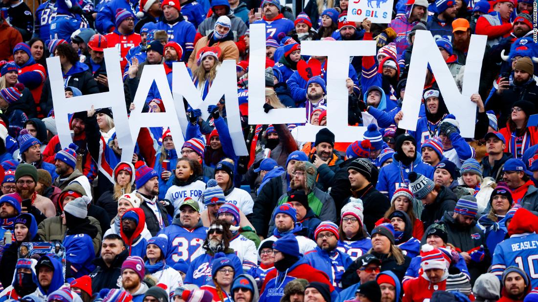 Fans hold a sign in support of Buffalo Bills safety Damar Hamlin during the second half of the game against the New England Patriots. On Sunday, a source told CNN that the Bills safety had shown continued progress with his recovery after his cardiac arrest and on-field collapse and expects to be released from the hospital in the coming days.