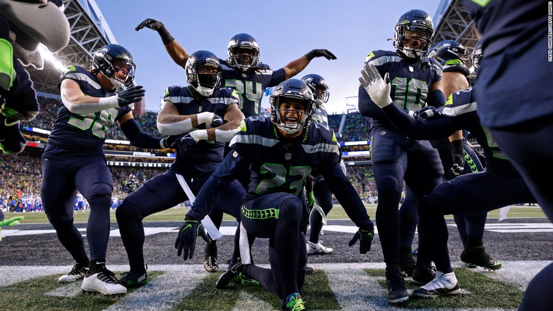 The Seattle Seahawks celebrate an interception by Quandre Diggs against the Los Angeles Rams in overtime at Lumen Field. Thanks to their 19-16 win and the Green Bay Packers&#39; defeat later in the day, the Seahawks claimed a wildcard spot in the NFC playoffs. 