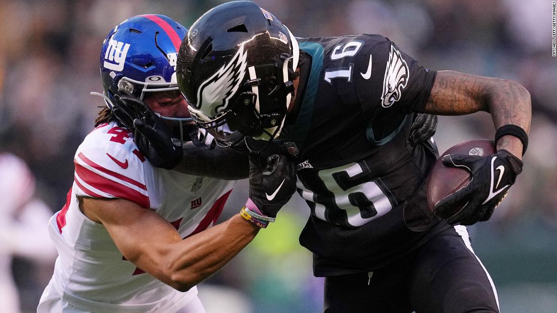Quez Watkins of the Philadelphia Eagles stiff-arms the New York Giants&#39; Nick McCloud during the first quarter at Lincoln Financial Field. Eagles star quarterback Jalen Hurts returned to the line-up on Sunday and helped the team to a 22-16 win over the Giants, clinching the No. 1 seed in the NFC playoffs. 