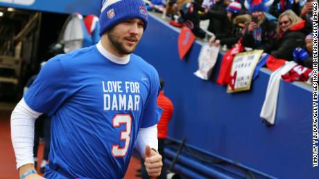 Allen jogs onto the field wearing t-shirt paying tribute to Damar Hamlin before the game against the Patriots.