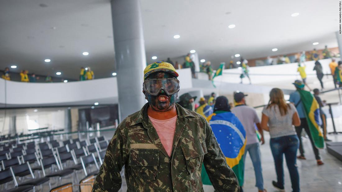 A supporter of Brazil&#39;s former President Jair Bolsonaro is pictured inside Planalto Palace.