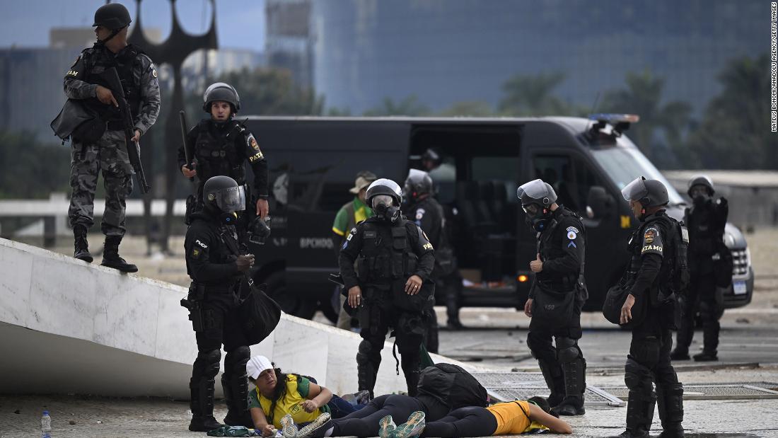 Supporters of former President Jair Bolsonaro are detained by security forces as they raid the National Congress in Brasilia.