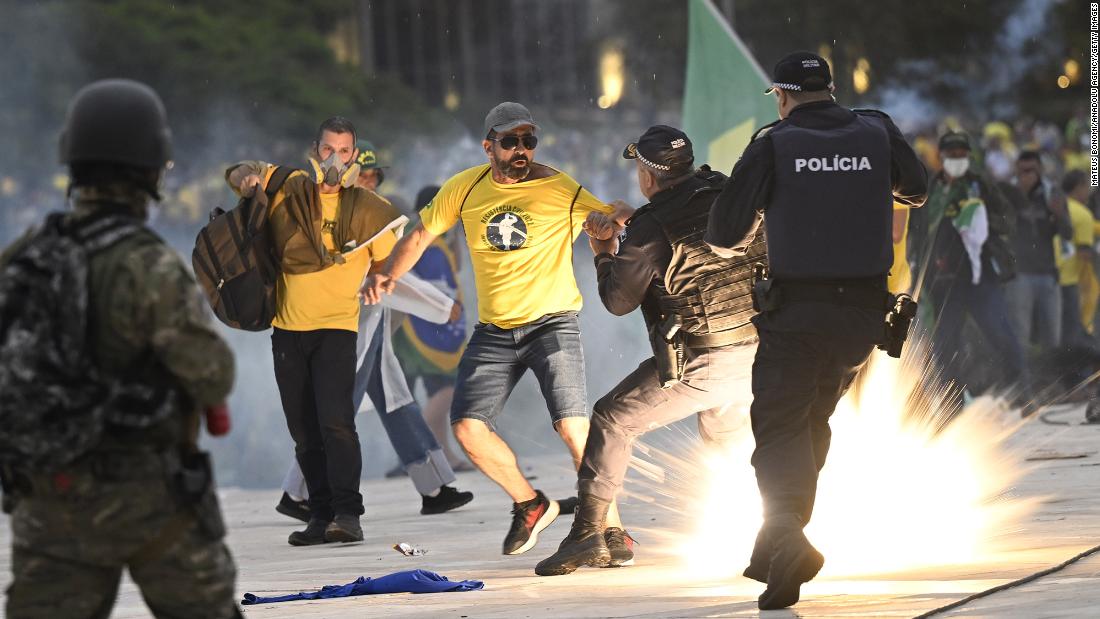 Supporters of former President Jair Bolsonaro supporters clash with security forces as they raid the National Congress in Brasilia