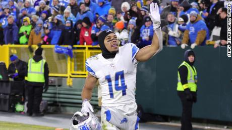 Amon-Ra St. Brown of the Detroit Lions greets fans after defeating the Green Bay Packers at Lambeau Field Sunday in Green Bay, Wisconsin. 