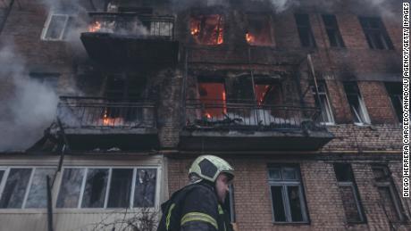 Ukrainian firefighters extinguish a fire after Russian army shelling of Bakhmut, Ukraine on December 7, 2022.