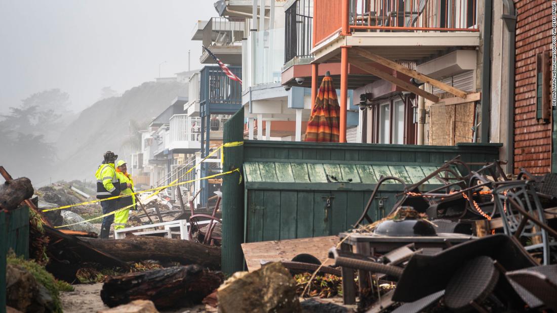 Cleanup takes place in Aptos on January 9 after streets and homes were flooded near the Rio Del Mar State Beach.