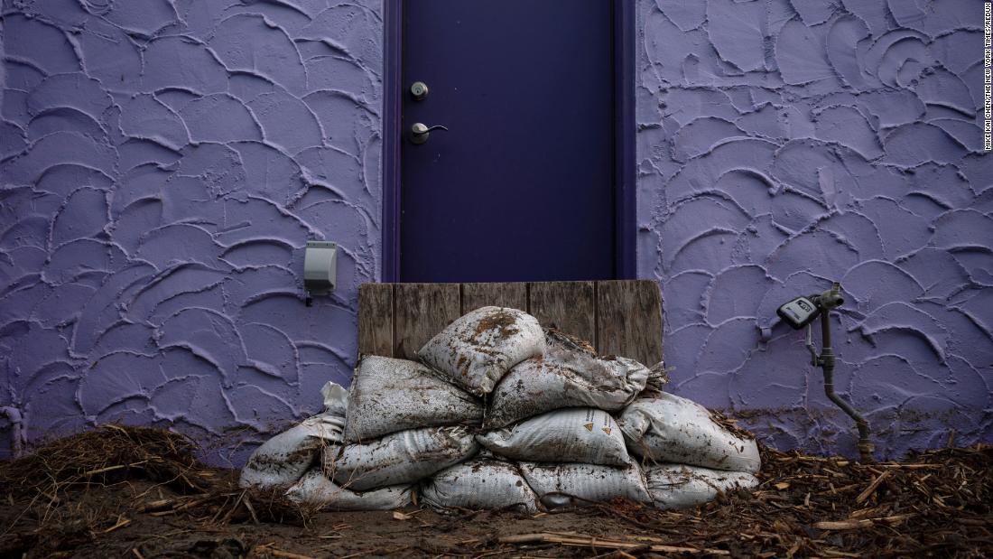 Sandbages are piled in front of a door in Capitola on January 6.