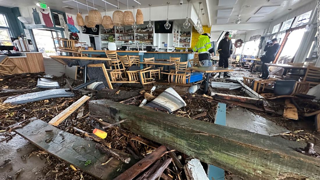 A support piece from the Capitola Wharf is seen inside the storm-damaged restaurant Zelda&#39;s on the Beach.