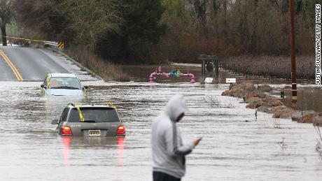 Cars are submerged in floodwater after heavy rain moved through Windsor, California, on Monday.