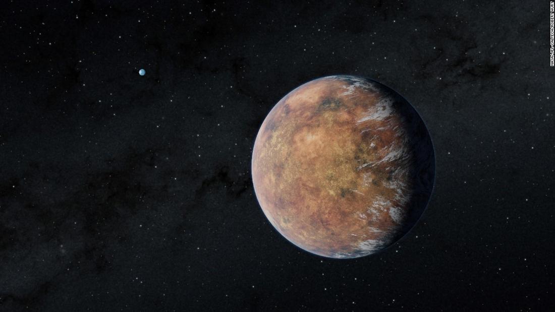 This illustration shows an Earth-size exoplanet called TOI 700 e, discovered orbiting the small, cool M dwarf star TOI 700, which is located 100 light-years away. Its other Earth-size sibling, TOI 700 d, can be seen in the distance. 