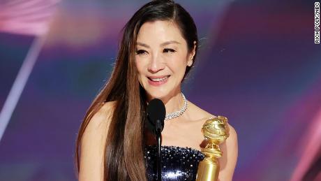 Michelle Yeoh accepts the best actress in a motion picture -- musical or comedy award for &quot;Everything Everywhere All at Once&quot; at the Golden Globe Awards on Tuesday.