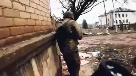Ukrainian soldiers fight Russian private military group in strategic town