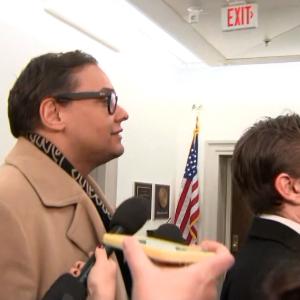 Watch reporters swarm George Santos as NY GOP leaders call for his resignation