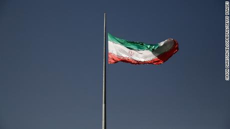 An Iranian national flag flies from a flagpole in a residential district of Tehran, Iran. The British government has called for Iran halt the execution and release Alireza Akbari.