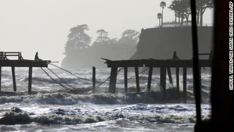 Waves in Monterey Bay battered the storm-damaged Capitola Wharf on Tuesday.