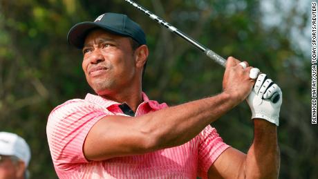 Tiger Woods hits his opening drive of the PNC Championship golf tournament  in December.