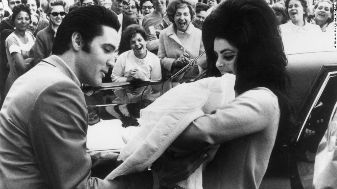 Elvis and Priscilla Presley hold their newborn daughter, Lisa Marie, in February 1968. She was born in Memphis, Tennessee.