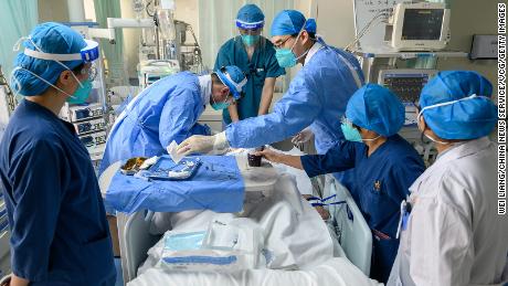 Medical workers treat a Covid-19 patient with severe symptoms at a hospital in Shanxi province on January 9.