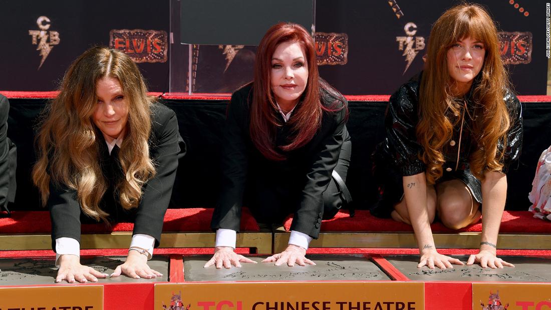 From left, Lisa Marie Presley, Priscilla Presley and Riley Keough have their handprints made at the TCL Chinese Theatre in Hollywood in June 2022.
