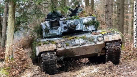 A Polish Leopard 2 stands in a wooded area during the international military exercise &quot;Allied Spirit 2022&quot; at the Hohenfels military training area on January 27, 2022. 